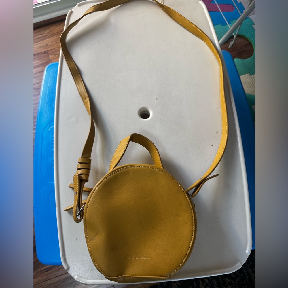 French connection yellow mustard crossbody bag it’s bent from storage